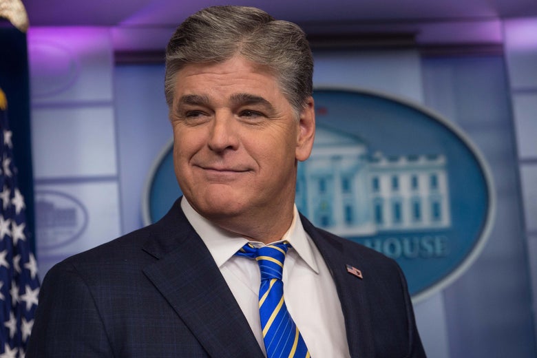 Sean Hannity in the White House briefing room, smiling smugly.